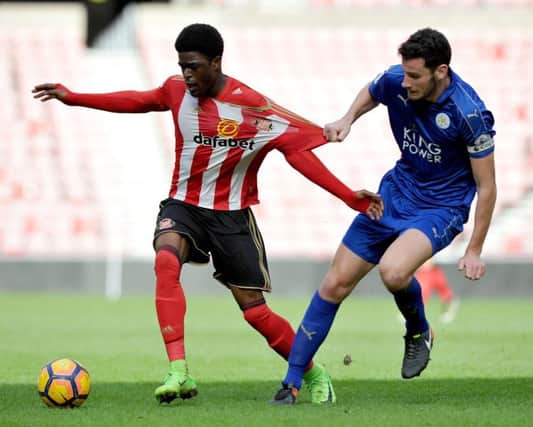 Josh Maja gets his shirt pulled by a Leicester defender. Picture by Frank Reid