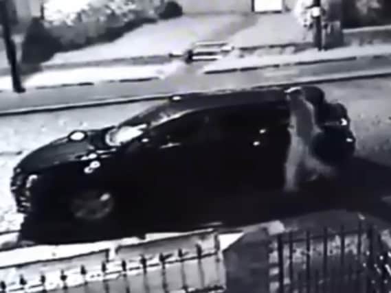 CCTV footage of the vandal keying a car.