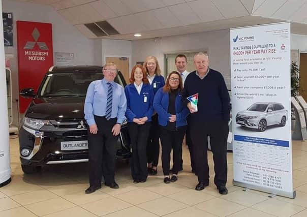 Staff at Vic Young in the dealership after winning the Services Award, sponsored by the University of Sunderland, at the North East Business Awards.
