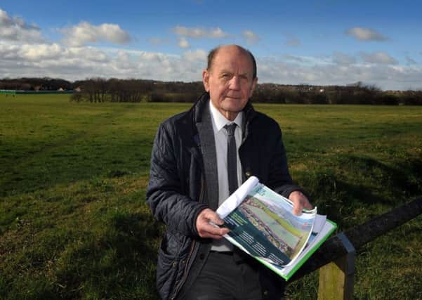 Coun George Howe stands on land owned by the University of Sunderland, Weardale Aveune, South Bents, which is being sold.