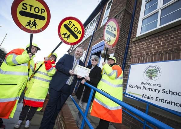 Thora Muir  with pupils and three school crossing patrols from Horden and the councils road safety manager Paul Watson