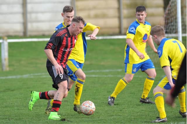 Ashbrooke Belford (black and red) take on Wolviston in their recent clash. Picture by Tim Richardson