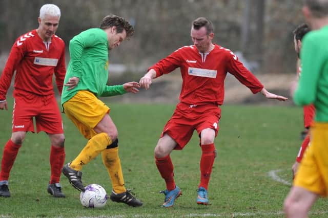 Wearmouth CW (red) take on Consett in last week's cup tie. Picture by Tim Richardson