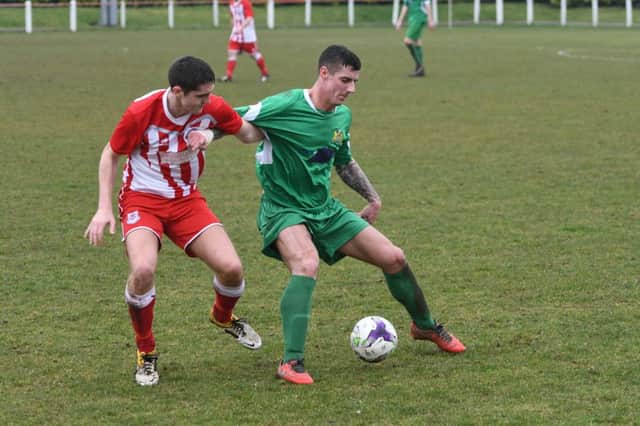 Seaham Red Star (red and white) battle against Newcastle Benfield last weekend. Picture by Kevin Brady