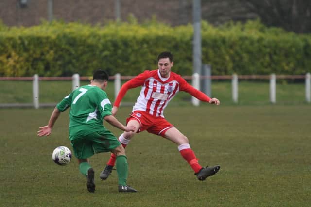 Seaham Red Star (red/white) defend against Newcastle Benfield last week. Picture by Kevin Brady
