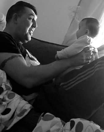 Lee Downey with his baby niece Ruby.