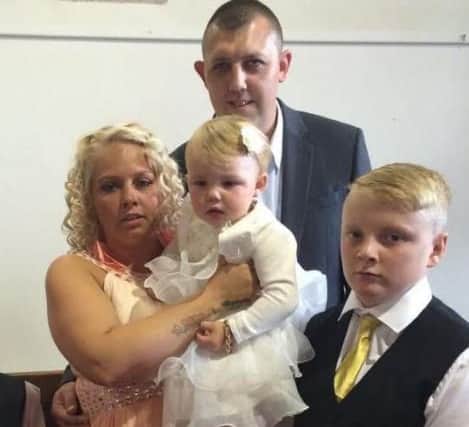 Lee Downey with his partner, Adele Gale, and children, Bailey and Millie.