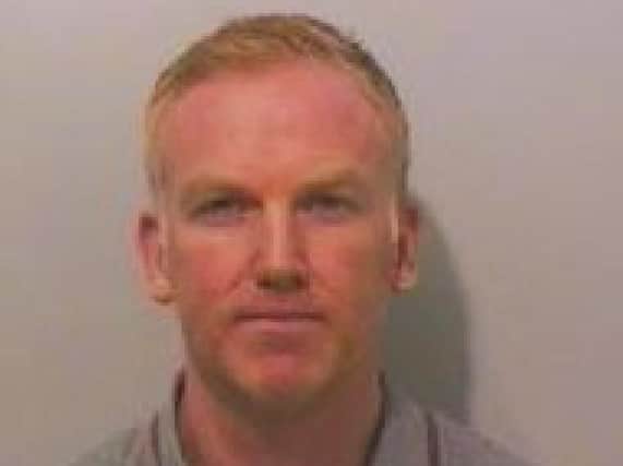 Shamed police officer Gary Christie has been jailed for two years.