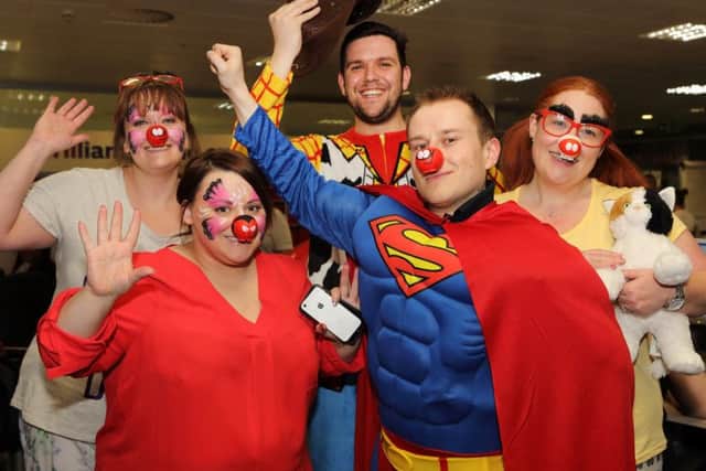 Npower's Mike Davies (as Superman) with the team last time the company fielded calls for Comic Relief