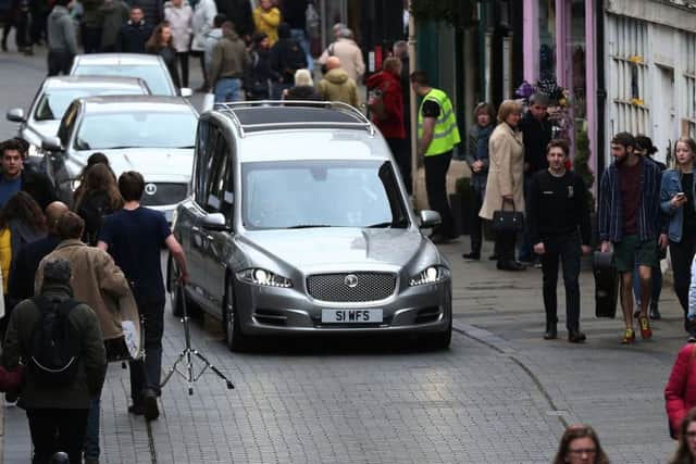 The funeral car of Neil Fingleton makes its way to Durham Cathedral.