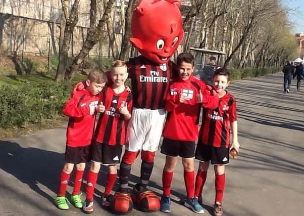 Dominic McCabe, second left, and Vinnie Owens, far right, with other youngsters in Milan last year.
