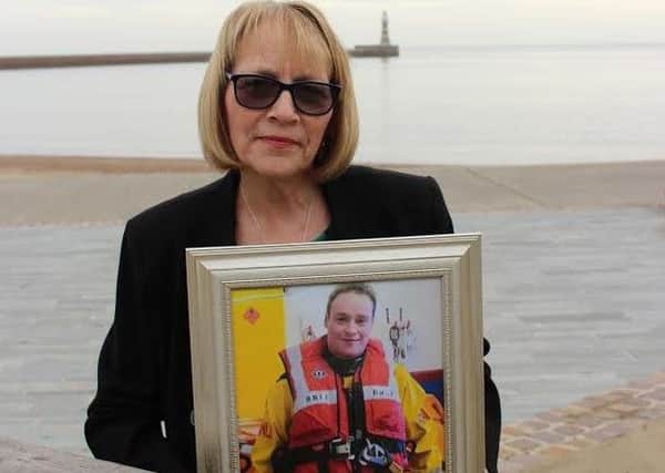 Ann Cantle with a picture of her son Andrew.