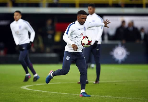 Jermain Defoe warms up before the Germany friendly