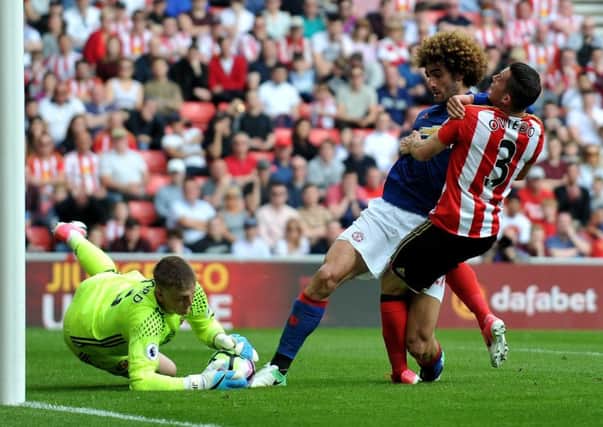 Jordan Pickford and Bryan Oviedo combine to thwart Manchester United captain Marouane Fellaini. Picture by Frank Reid