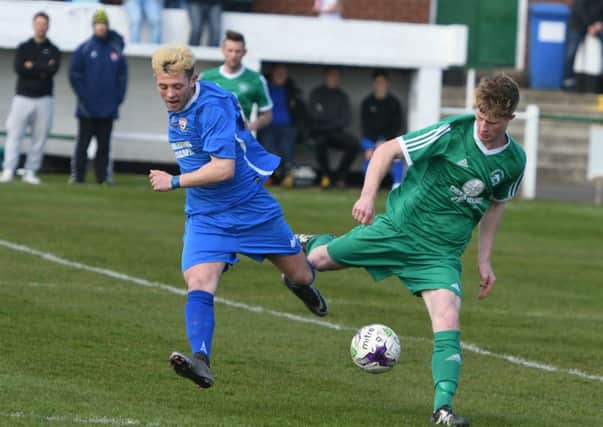 Easington Colliery (green) battle against Brandon United. Pictures by Kevin Brady