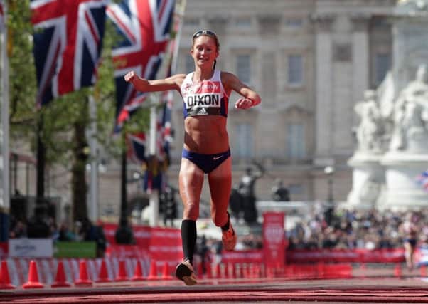 Alyson Dixon crosses the line in the London Marathon.