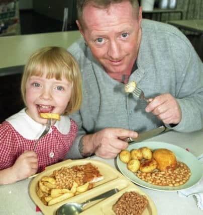 Kevin Furnevel samples school dinners with his daughter Lisa Jane.
