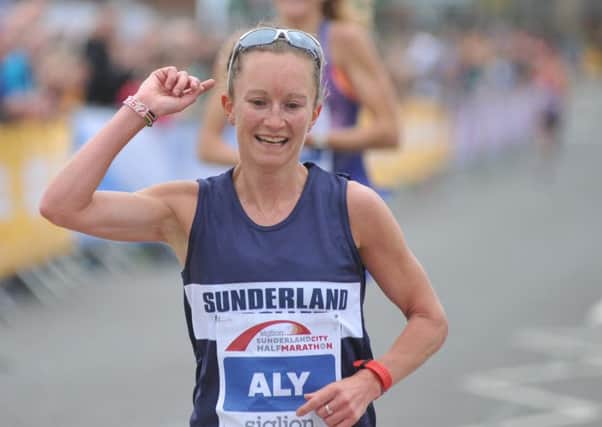 Alyson Dixon celebrates beating Paula Radcliffe in the sprint finish in the Siglion Sunderland Half Marathon. Pictures by Tim Richardson