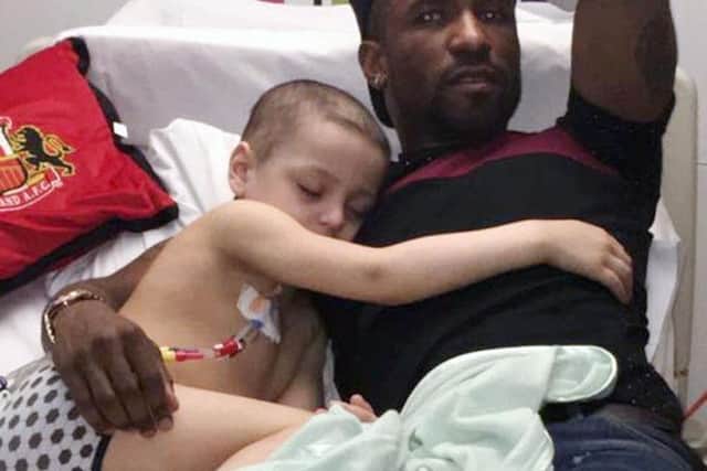 Bradley Lowery after he fell asleep on Sunderland football player Jermain Defoe in hospital.