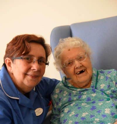 Highcliffe's senior care assistant Shirley Kinge with Jennie Morton.