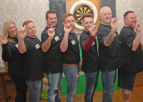 The Grundfos darts team during their charity event.