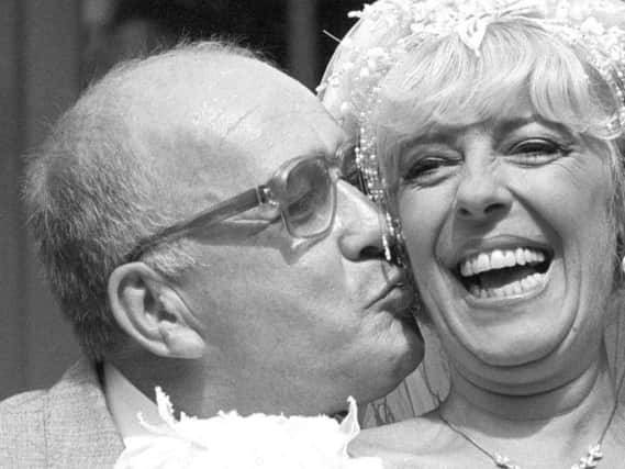 File photo dated 17/08/87 of Coronation Street barmaid Bet Lynch (actress Julie Goodyear) getting a kiss from television groom Alec Gilroy (actor Roy Barraclough). Picture by PA