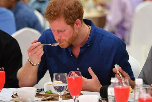 Prince Harry sits down for iftar, breaking of the fast during Ramadan at the Jamiyah Education Centre in Singapore. Picture by Tim Rooke/PA Wire