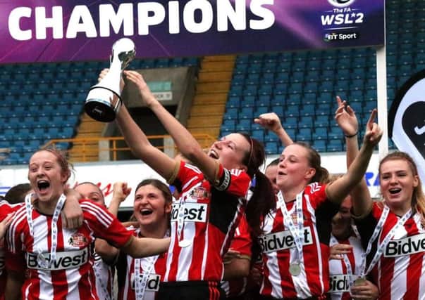 Steph Bannon lifts the WSL2 trophy in 2014
