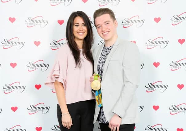 Sam Quek with Ryan Gibbons, right, after his impressive weight loss.