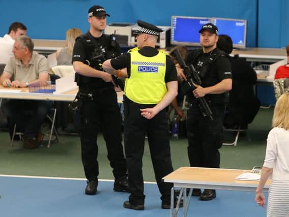 Armed police at Thursday night's counts.