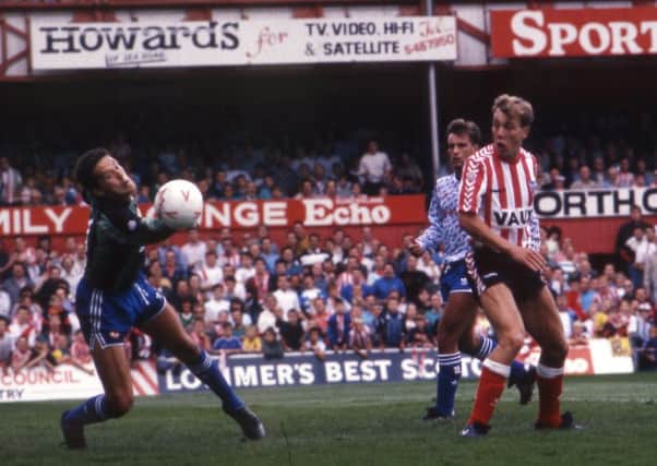 Gary Owers heads past Les Sealey to put Sunderland ahead against Manchester United in 1990. Pictures by Gilbert Johnston.