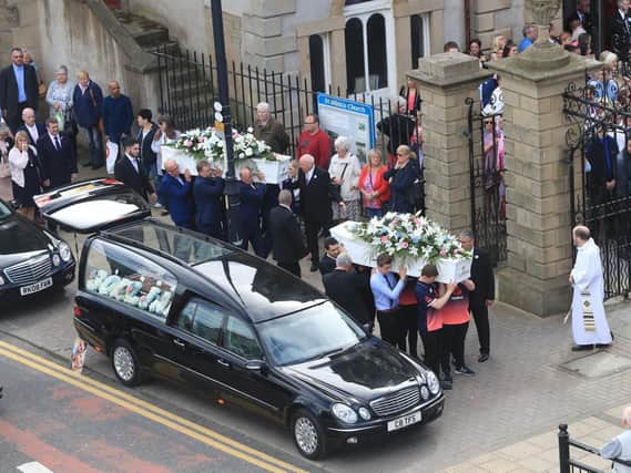 The coffins of Chloe Rutherford and Liam Curry arriving at St Hilda's Church for their funeral service. Pic: PA.
