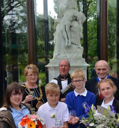 Annual Victoria Hall Memorial service.
Grange Town Primary children with Mayor Doris MacKnight, Reverend Ian Davies and consort Keith MacKnight