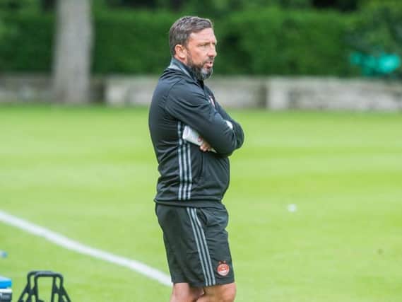 McInnes is staying at Aberdeen