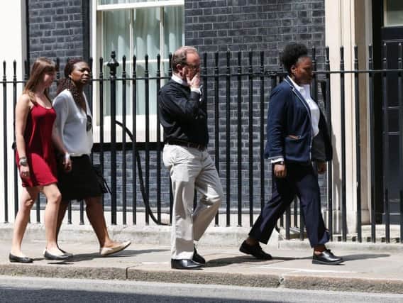 Victims, volunteers and community leaders from the Grenfell Tower disaster, arrive in Downing Street in London, for a meeting with Prime Minister Theresa May.