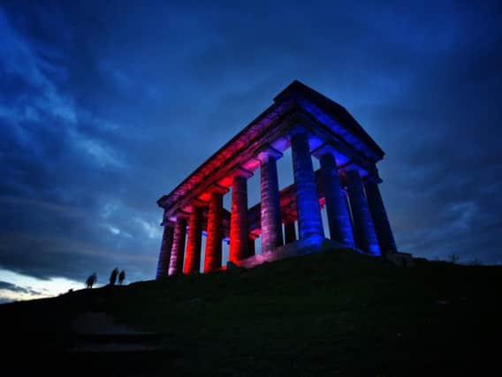 Penshaw Monument lit red, white and blue. Picture issued by Sunderland City Council