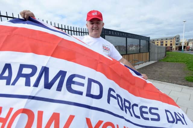 Paul Jasper flies the flag for Armed Forces Day