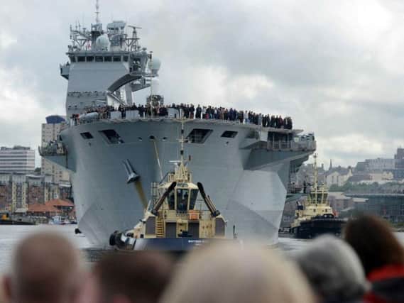 Crowds say a fond farewell to HMS Ocean.