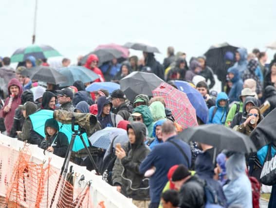 Crowds shelter from the rain at Sunderland International Airshow.