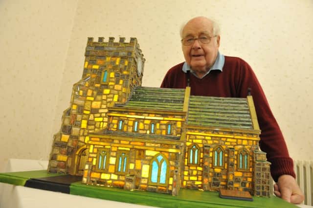 Bob Young with his glass model of St Mary's Church, Easington.