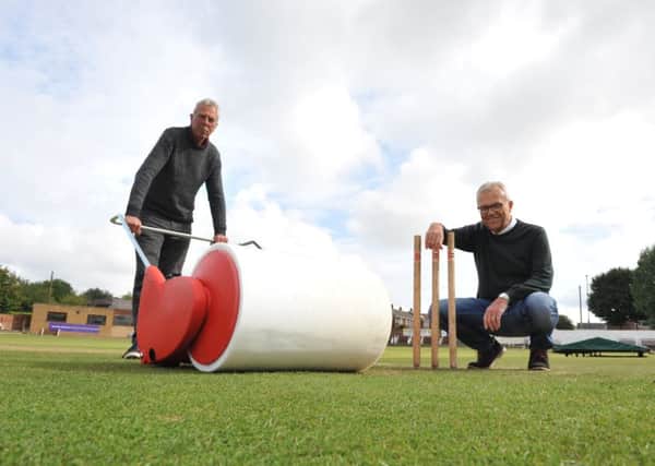Eppleton Cricket Club groundsman Kevin Galley, left, and club secretary Jeff Park with the new water machine.