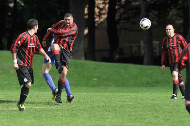 Pennywell Comrades (red) try a shot against Pennywell Vets in last week's Over-40s League clash
