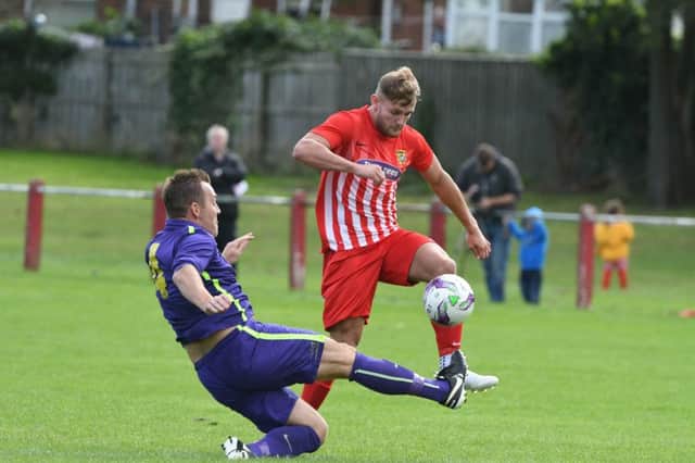 Ryhope CW (red/white) attack against Guisborough Town in the FA Vase last weekend.
