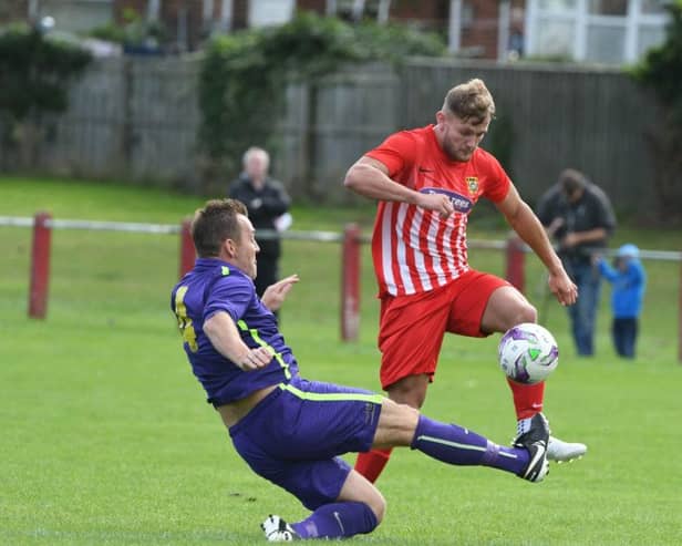 Ryhope CW (red/white) attack against Guisborough Town in the FA Vase last weekend.