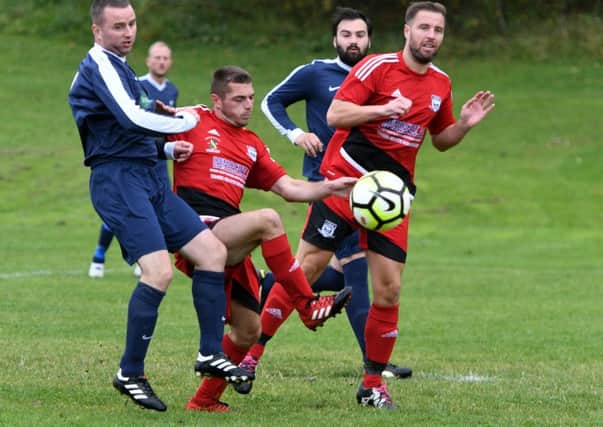 Southwick (red) and Sunderland Railway Club scrap for the ball last weekend.
