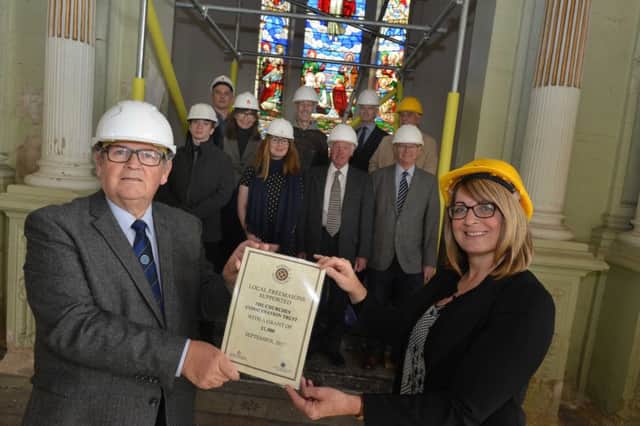 Durham Benevolence Ltd Robin Middleton donates funds to Holy Trinity Church restoration project co-ordinator Amanda Gerry