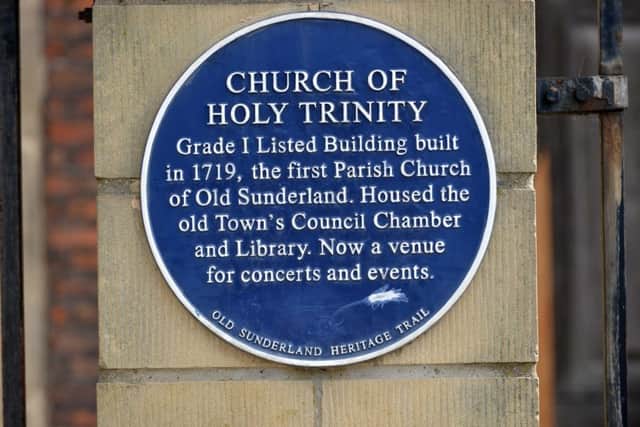 The blue plaque outside Holy Trinity Church.