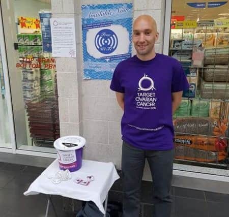 Scott Baker collecting in Byron Place in aid of Target Ovarian Cancer.