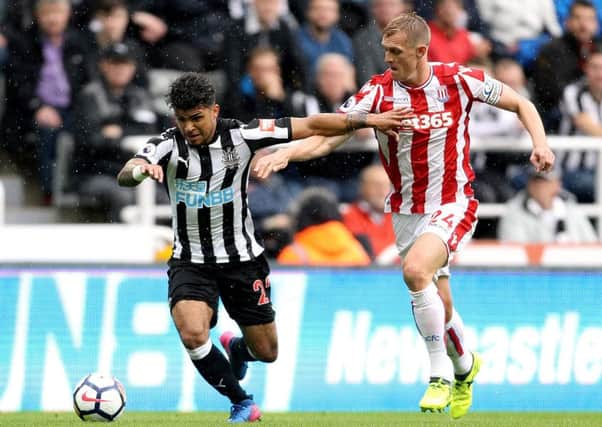 Newcastle United's DeAndre Yedlin takes on Stoke's Darren Fletcher.