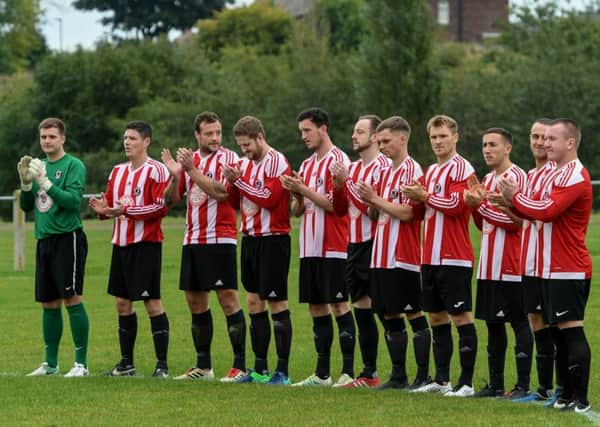 Sunderland West End hold a minute's applause in memory of honorary president Arthur Bond on Saturday.